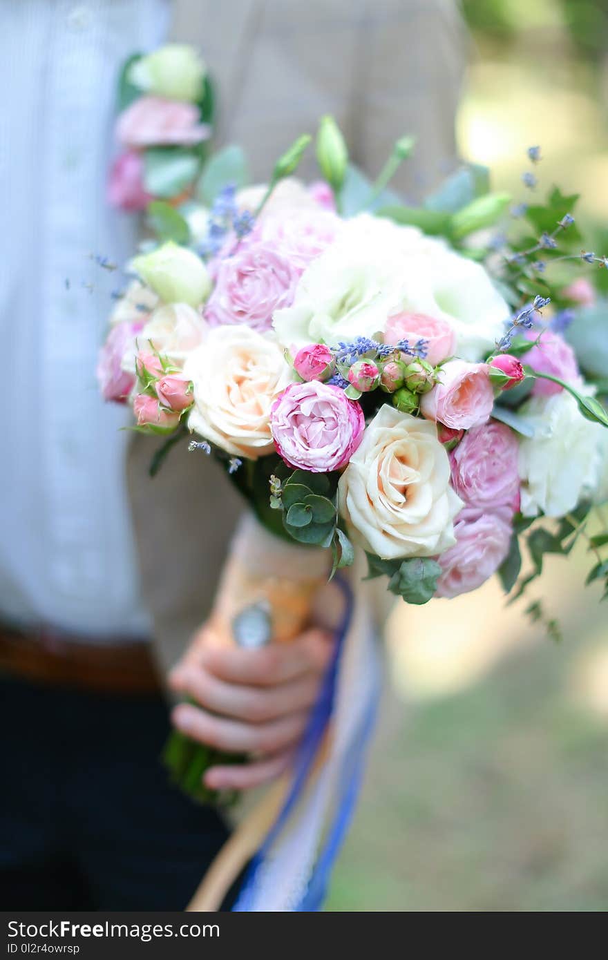 Closeup Nice Bouquet Of Flowers In Fiancee And Groom Hands.