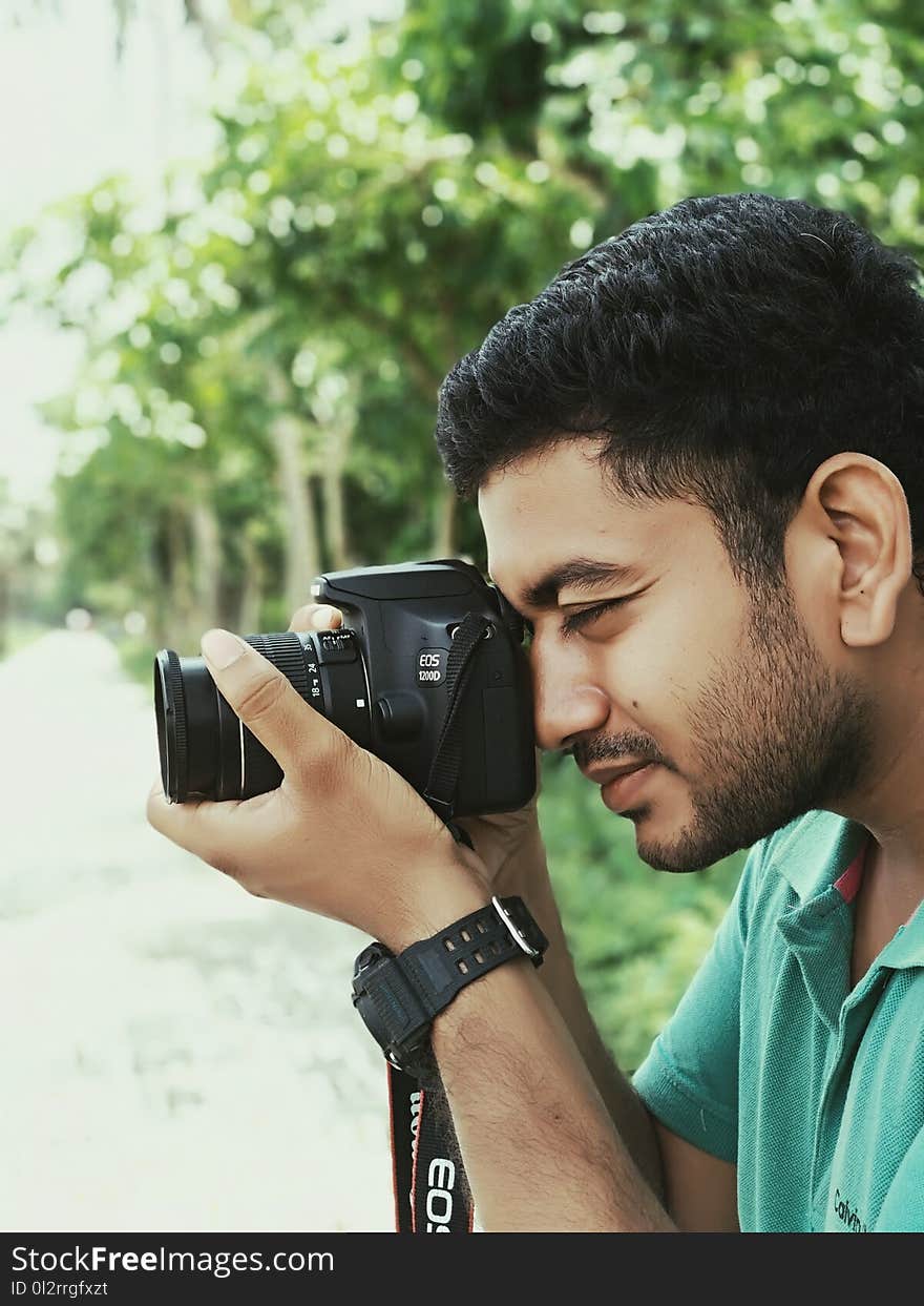 Man Using Canon Eos Camera