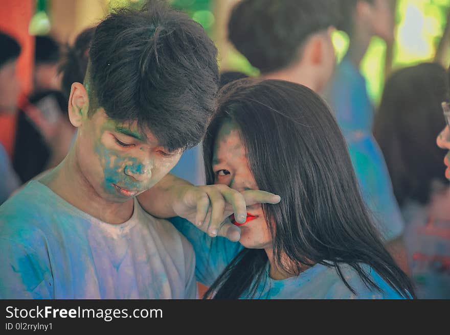 Man and Woman Covered in Blue Powder