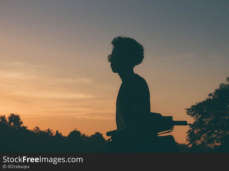 Silhouette Photo of Man Wearing Sunglasses