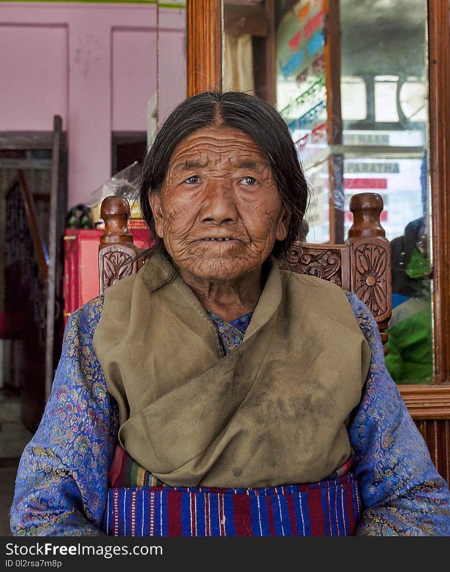 Woman in Brown and Blue Traditional Dress