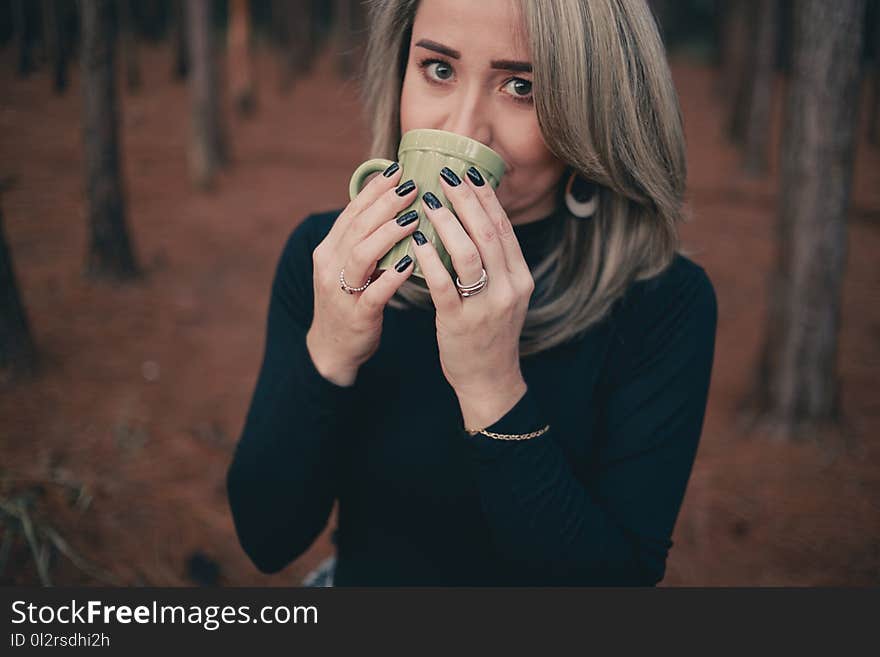 Woman Holding Grey Ceramic Mug