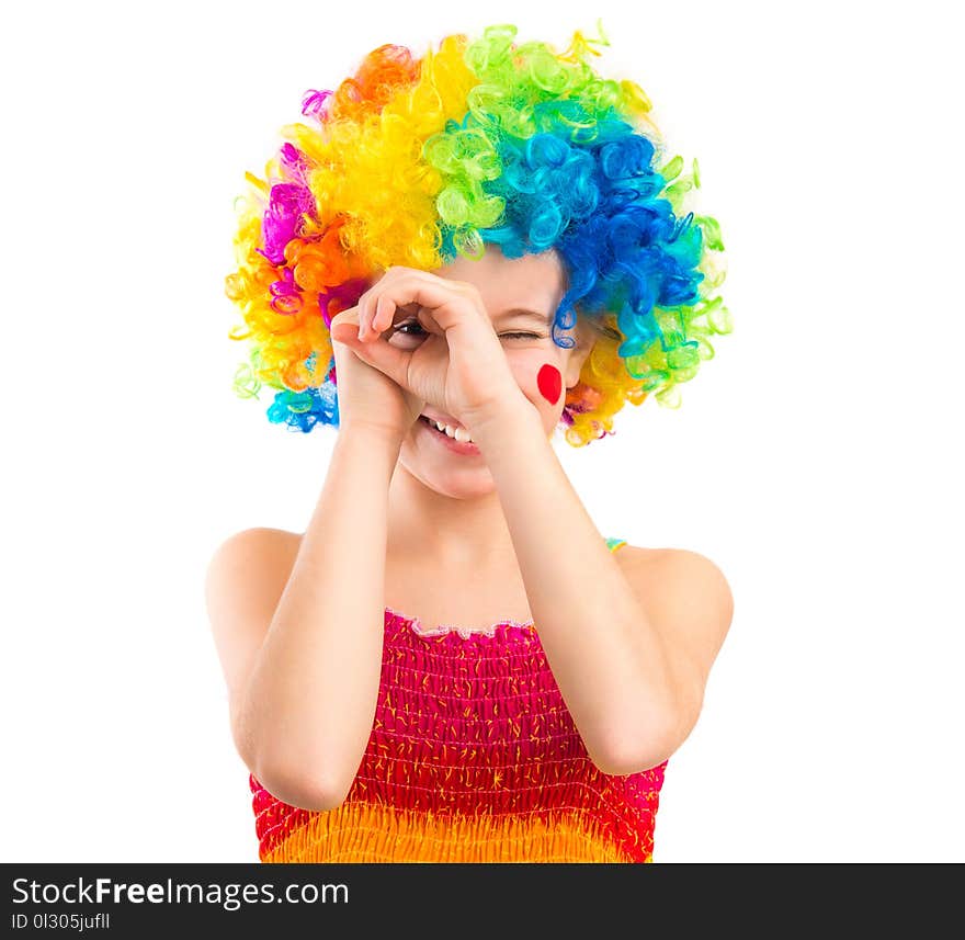 Cute little girl in colourful clown loooking through her hands like binocular, isolated on white backgrond. Cute little girl in colourful clown loooking through her hands like binocular, isolated on white backgrond