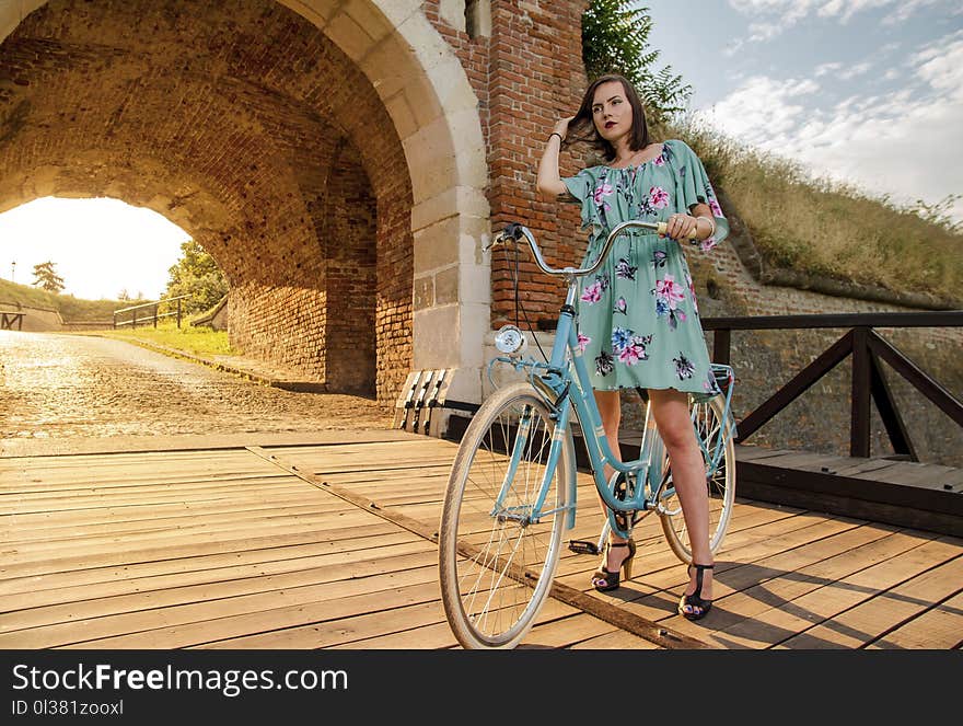 Summer day and girl on vintage bicycle