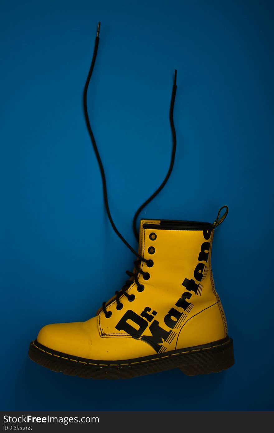 Unpaired Yellow Dr. Martens Lace-up Boot