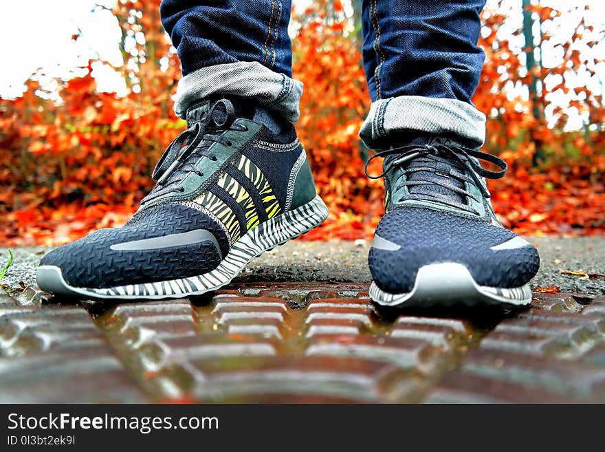 Shallow Focus Photography of Pair of Black Black-and-white Adidas Running Shoes