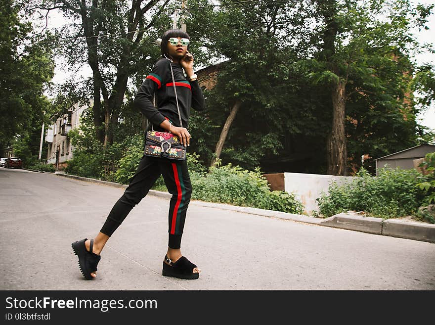 Woman Wearing Black-red-and-green Tracksuit