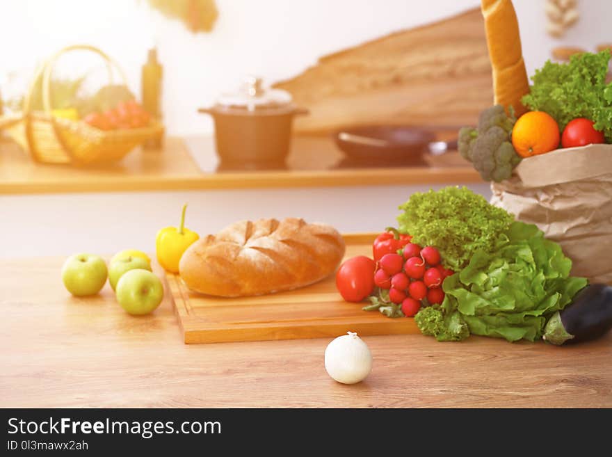 Desk With Many Fresh Vegetables And Fruits In The Kitchen. Cooking, Vegetarian And Shopping Concept.