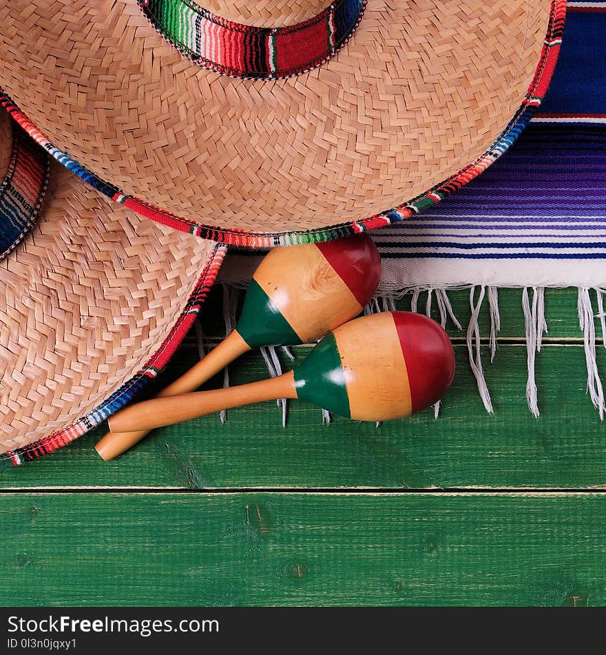 Mexican carnival sombrero and maracas fiesta scene top view