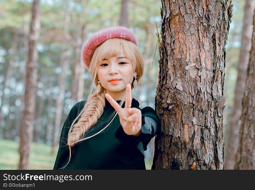 Blonde Haired Woman in Black Long-sleeved Top