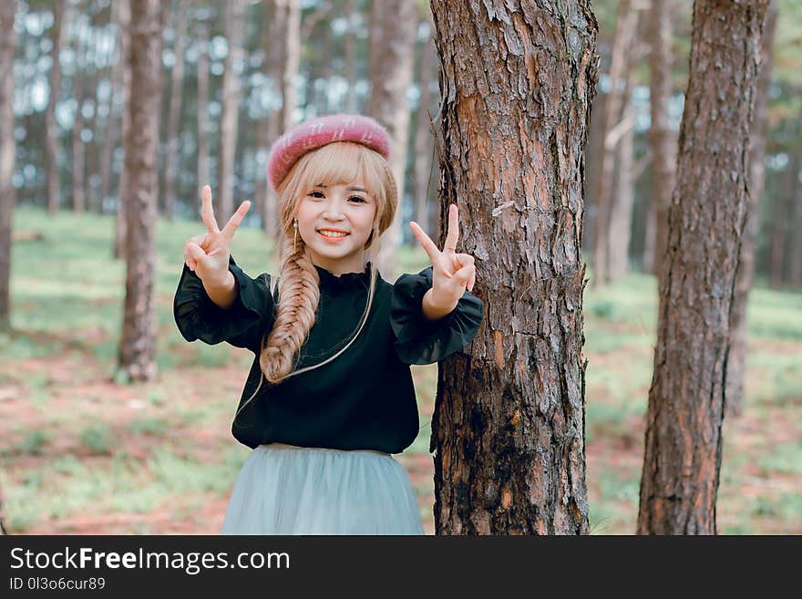 Girl Wearing Black Shirt Standing Near Tree