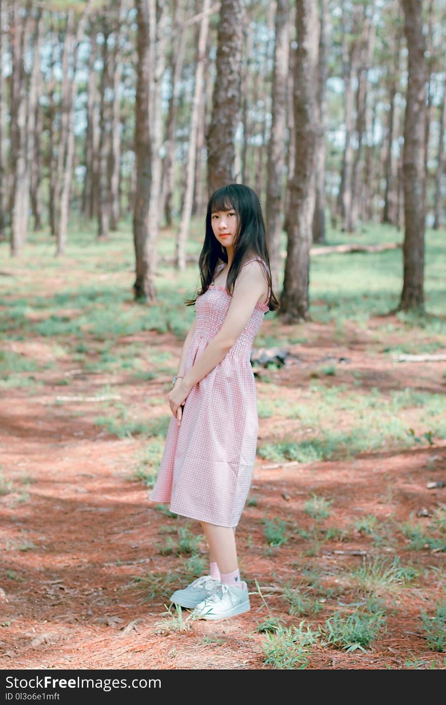 Woman Wearing Pink Sleeveless Dress