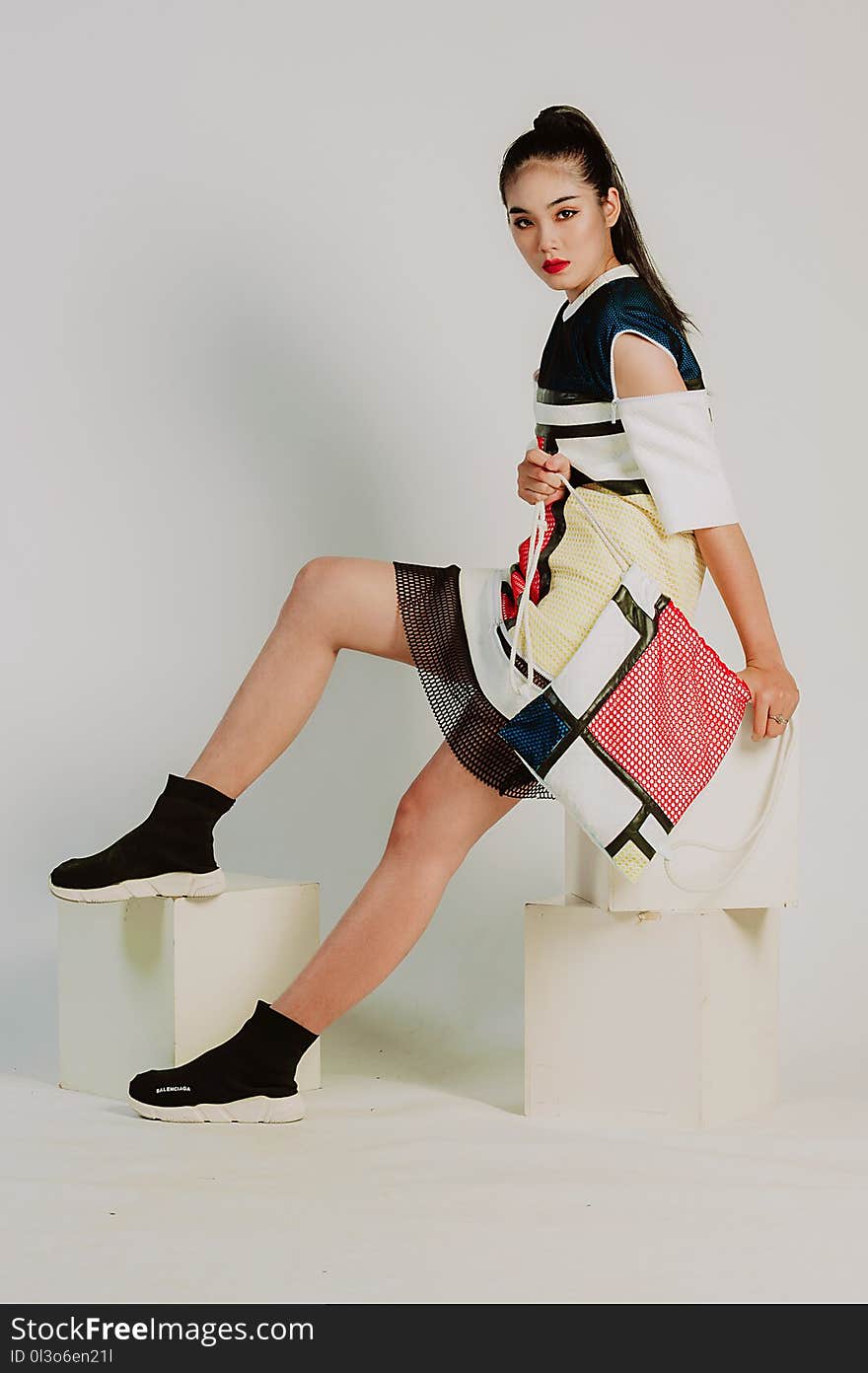 Woman Wearing Black, White, and Beige Off-shoulder Dress