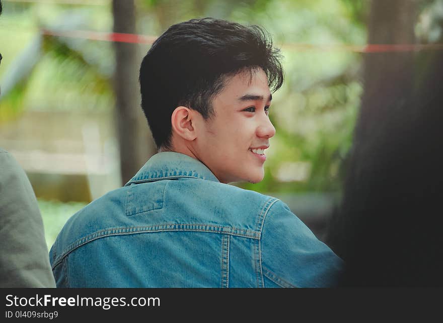 Close-Up Photo of Man Wearing Denim Jacket