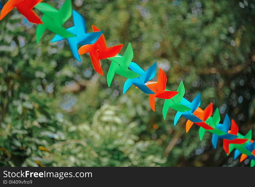 Selective Focus Photography of Pinwheels on String