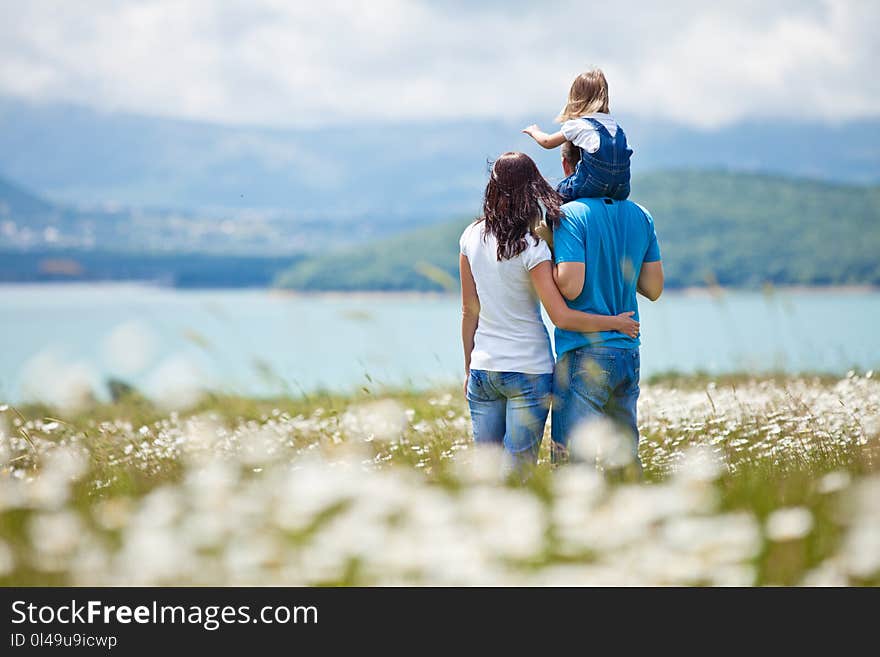 Chamomile field, happy family, lovely baby girl, bubbles. Chamomile field, happy family, lovely baby girl, bubbles