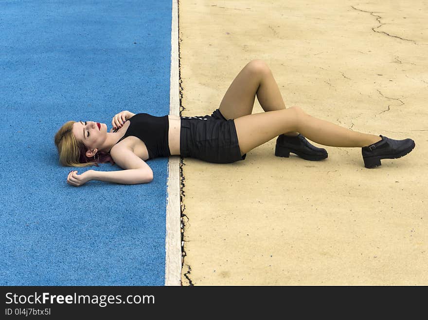 Woman Laying on Ground