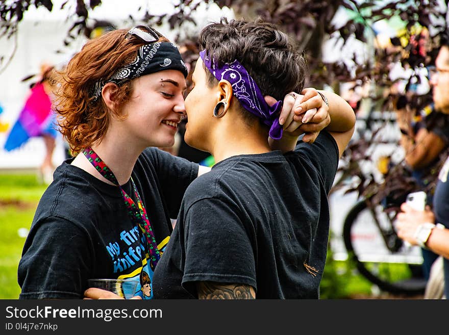 Photo of Women Facing Each Other