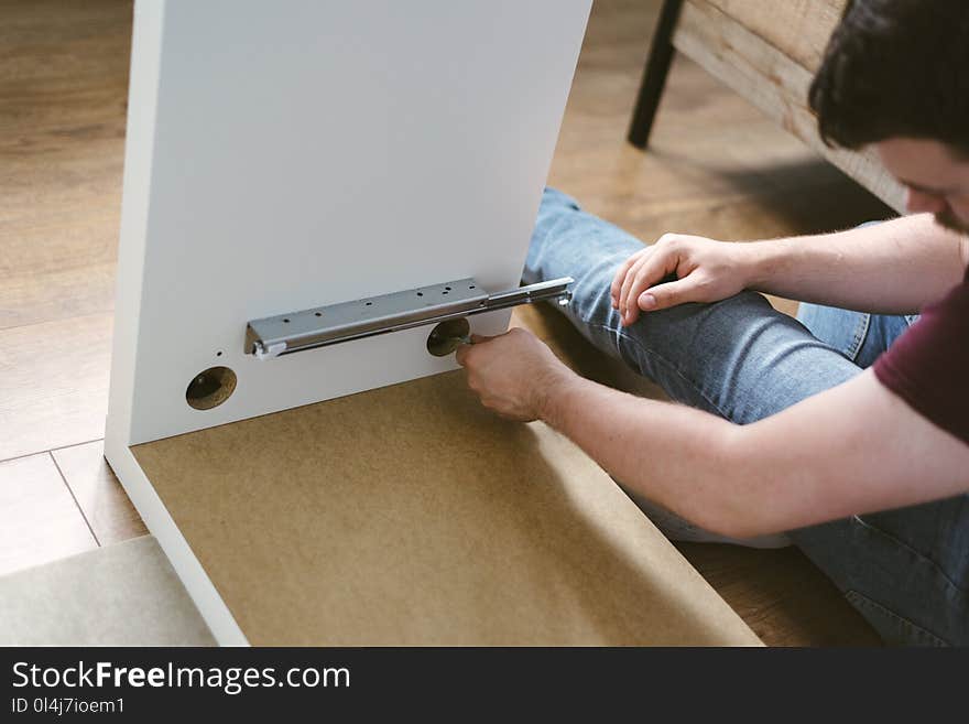 Photo of Man Assembling Furniture