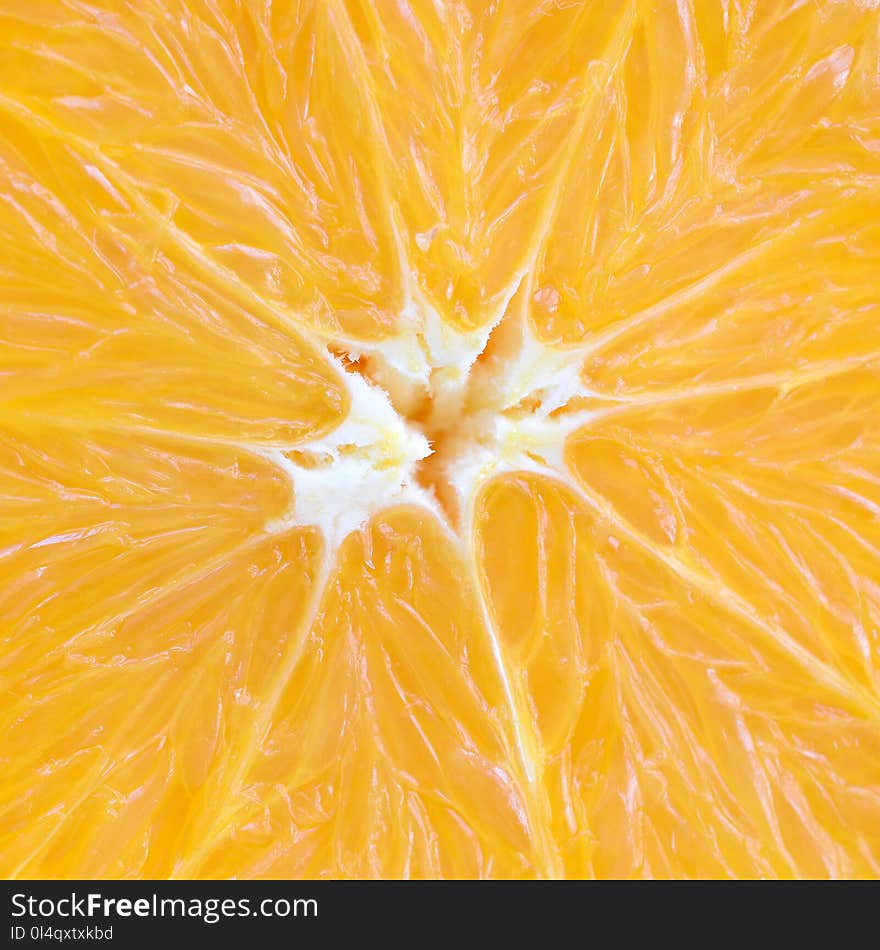 Top view of a fragment of the orange fruit slice close up. Macro