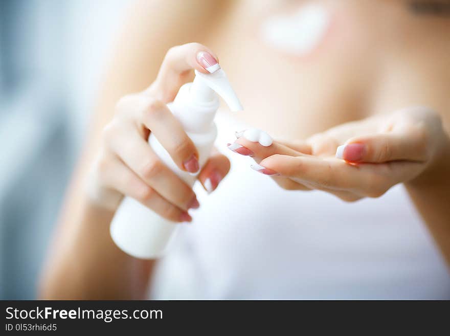 Hand Skin Care. Close Up Of Female Hands Holding Cream Tube, Beautiful Woman Hands With Natural Manicure Nails Applying Cosmetic