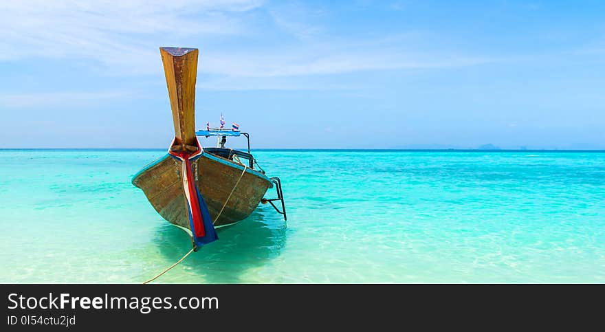 Amazing view of beautiful beach with traditional thailand longtale boat. Location: Bamboo