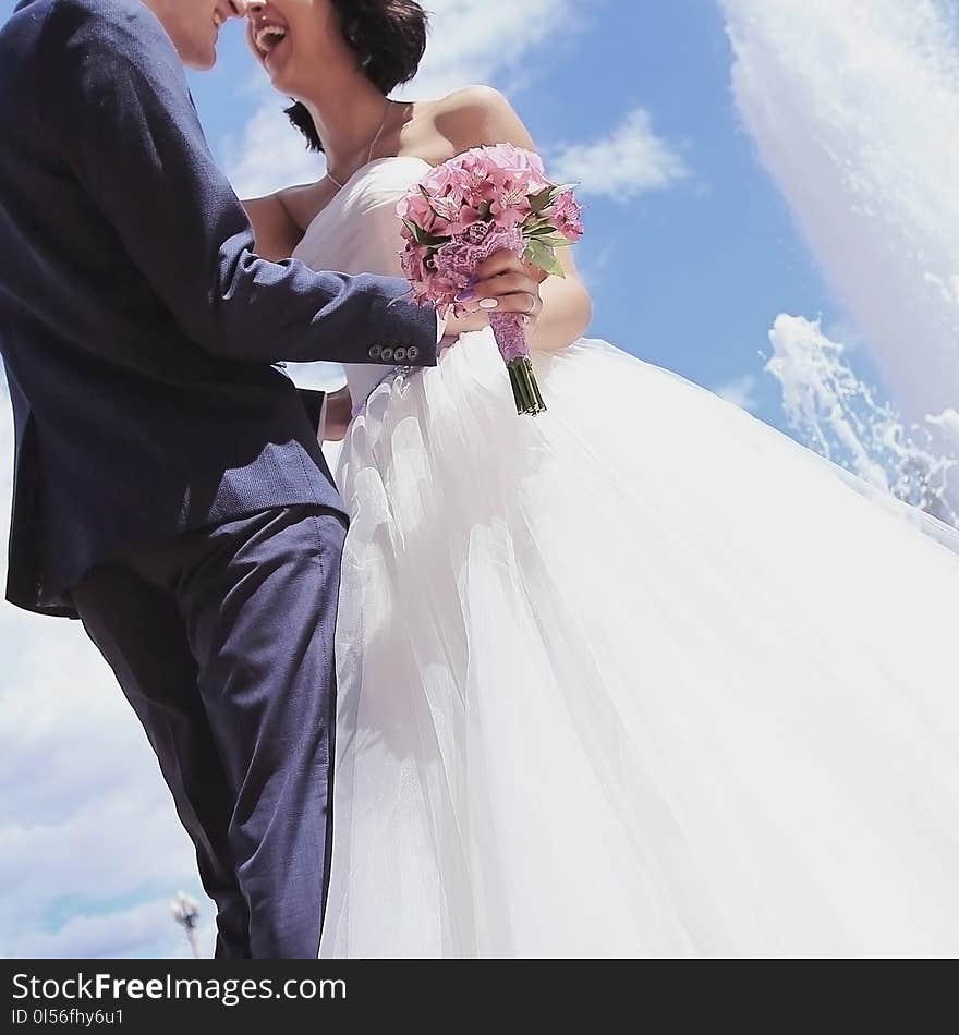 Happy couple on the wedding day. on the background of blue sky. Happy couple on the wedding day. on the background of blue sky