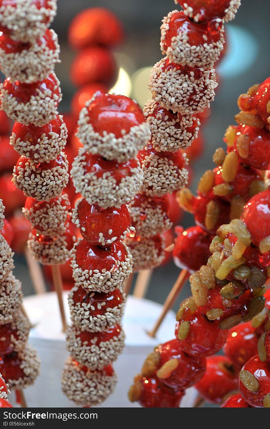 Bingtanghulu Crispy Sugar-Coated Fruit haws,yam,etc.on a Stick;a Beijing traditional Food with long history taste sweet yet tart;