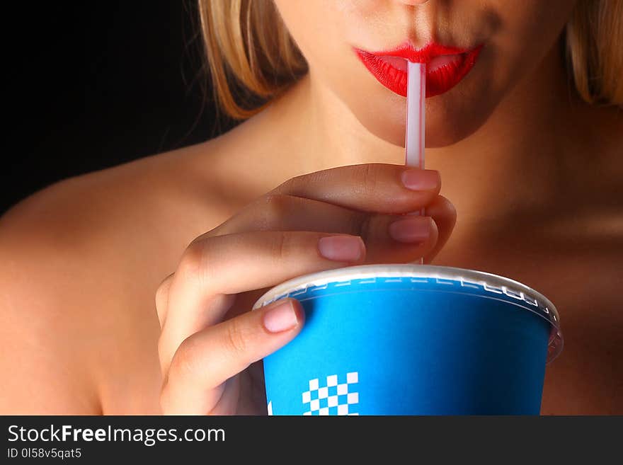 Woman Holding Blue and White Disposable Cup in Closeup Photography