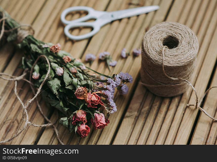 Pink Roses Bouquet Beside White Scissors