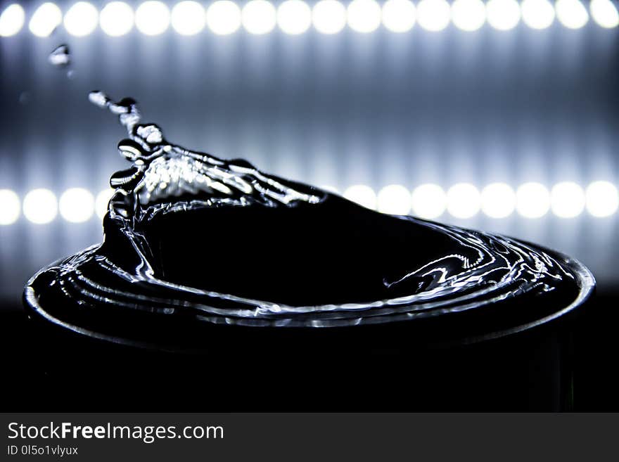 Water splashing and ripple occurs with lighting background,