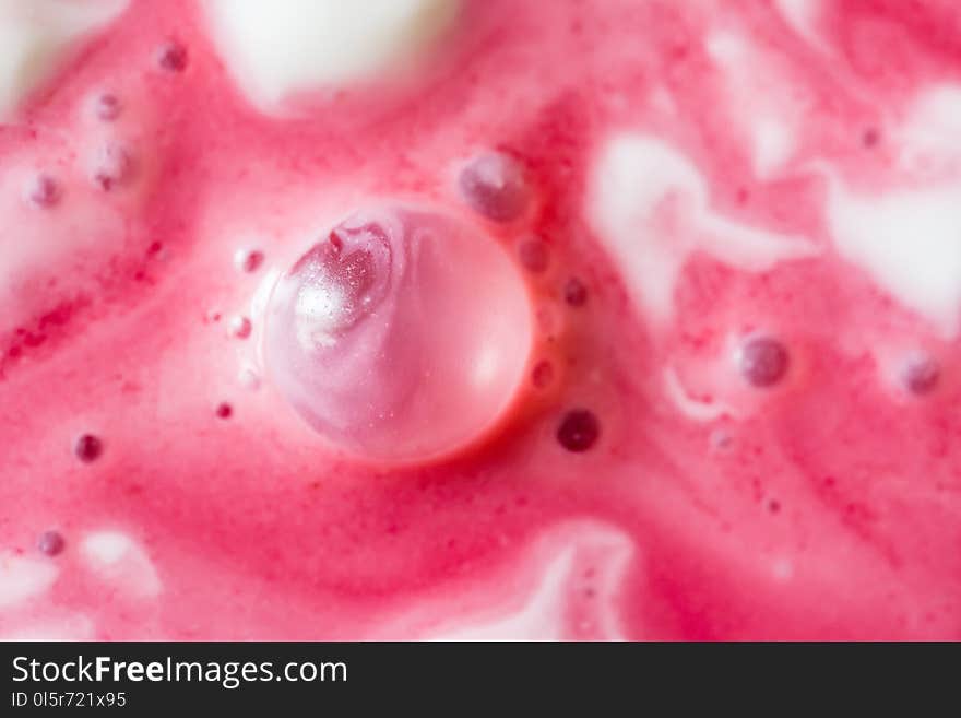 Close up texture of sour cream sauce and cherry juice. Close up texture of sour cream sauce and cherry juice