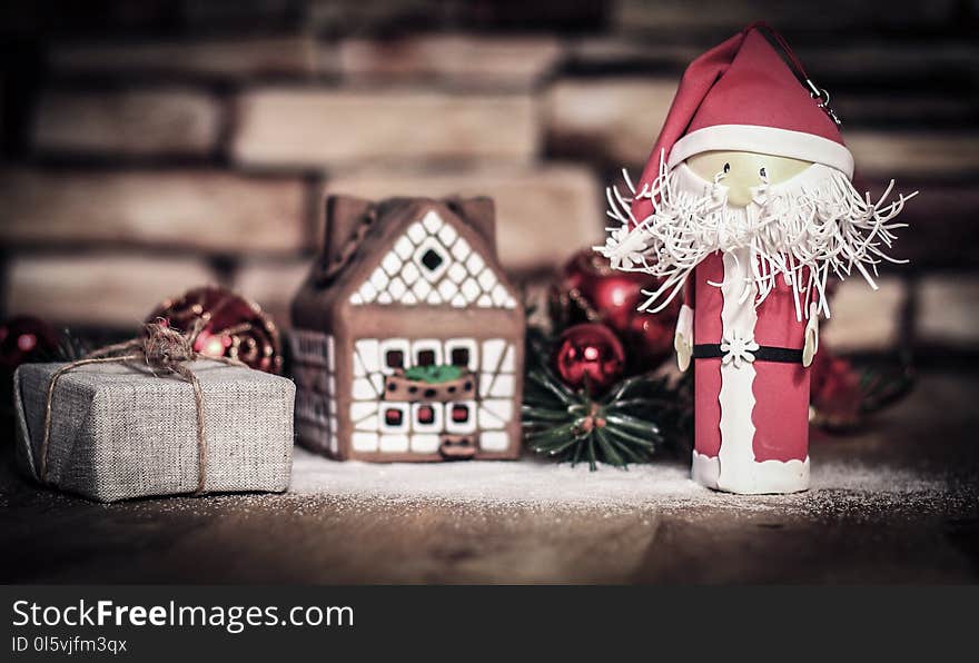 Christmas present on the background of a gingerbread house.photo with copy space