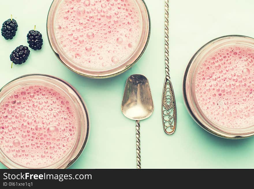 Smoothies Of Mulberries And Mint In Glass Jars