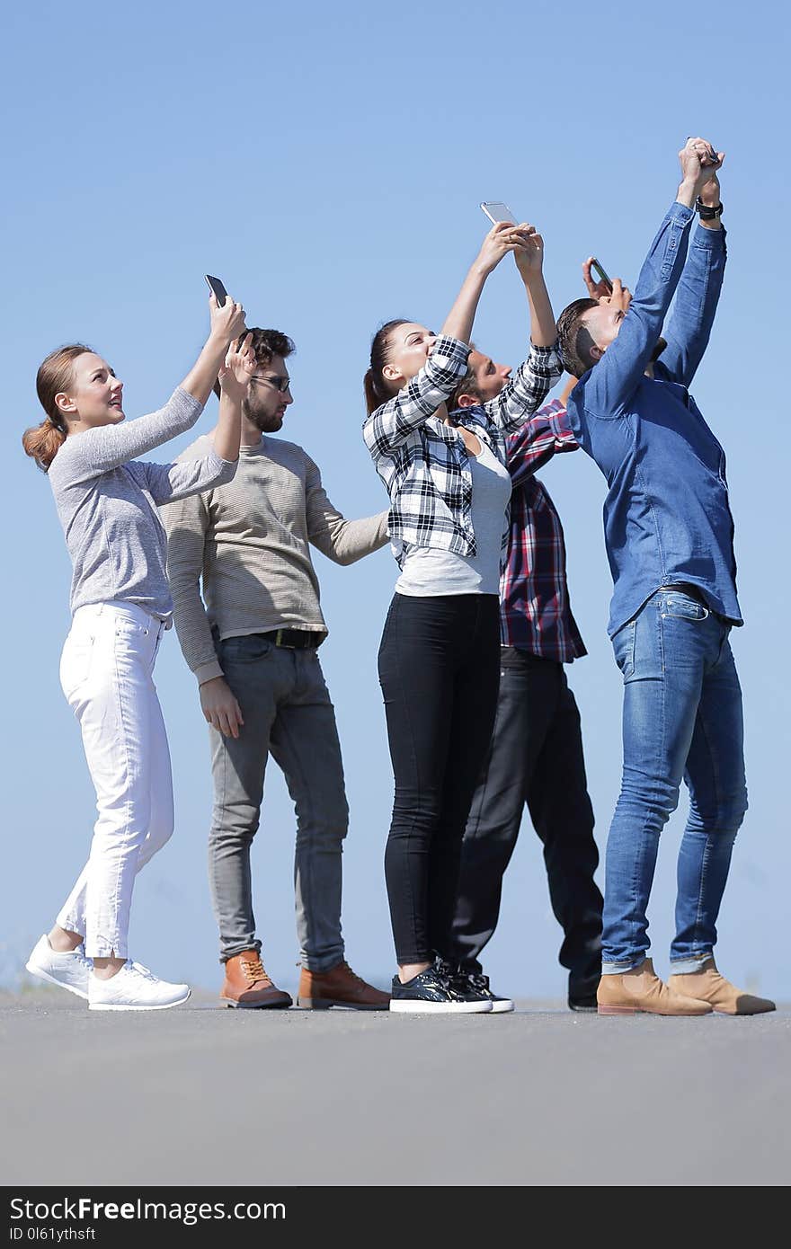 Rear View. Happy Friends Doing A Selfie.