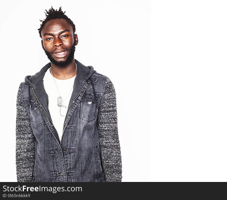 Young handsome afro american boy stylish hipster gesturing emotional isolated on white background smiling, people lifestyle concept close up