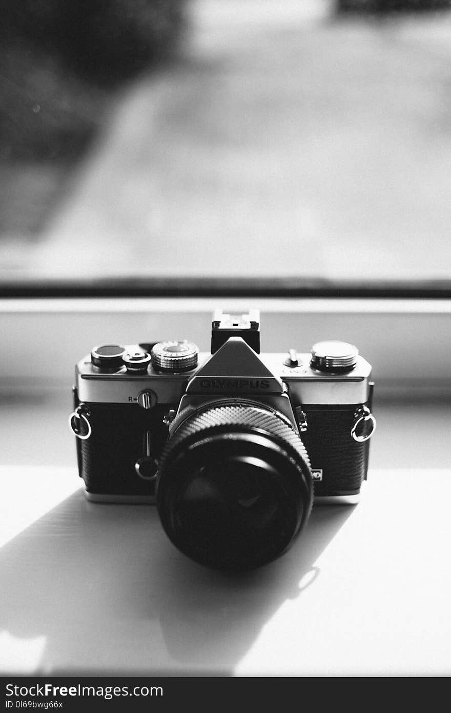 Grayscale Photography of Olympus Dslr Camera Near the Mirror