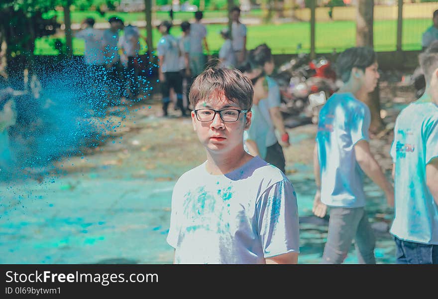 Man Wearing Blue Crew-neck Shirt Near People