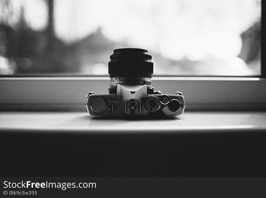 Grayscale Photo of Gray Mirrorless Camera