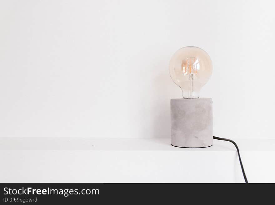 Light Bulb on White Panel