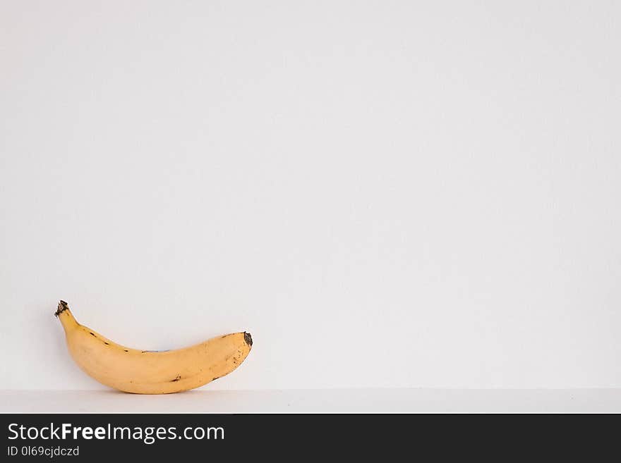 Yellow Banana Fruit on White Surface