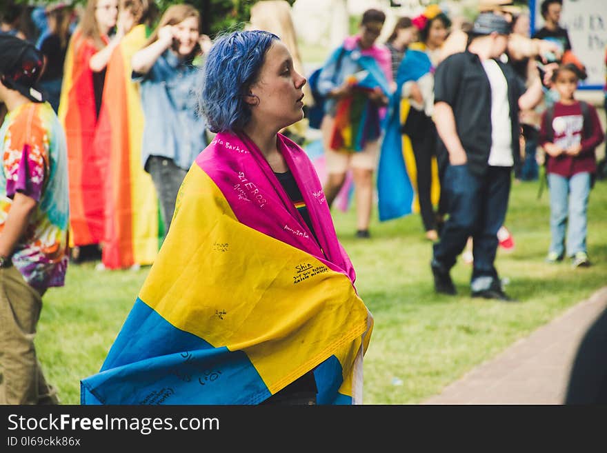 Focus Photo of Woman in Pink, Yellow, and Blue Dress