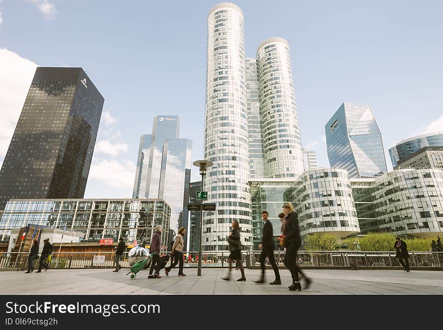 People Walking Near High Rise Buildings