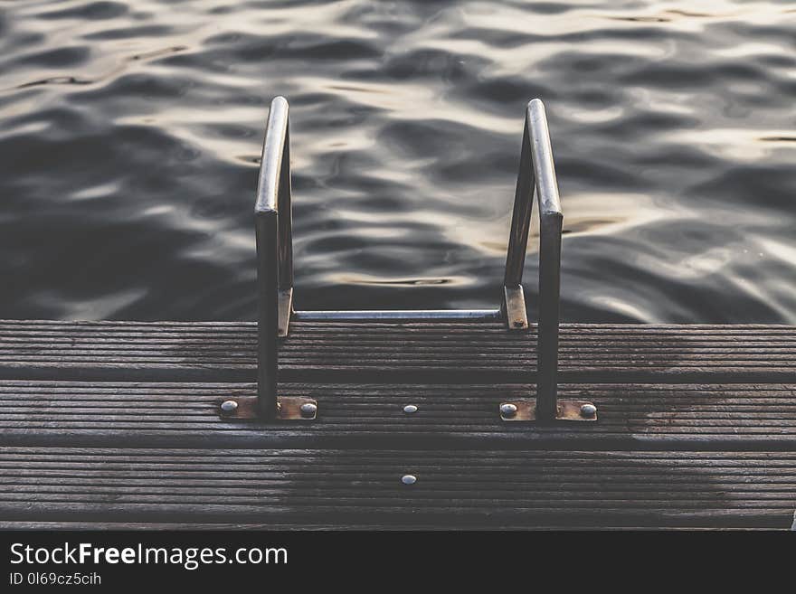 Gray Steel Dock Ladder Beside Body of Water