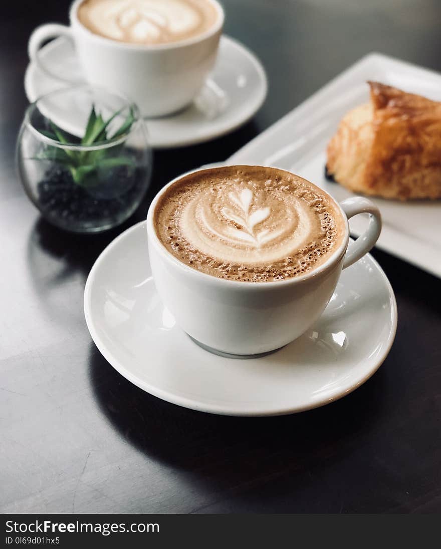 Selective Focus Photo of White Ceramic Mug on Saucer Filled With Espresso