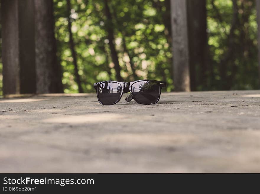 Shallow Focus Photography of Black Sunglasses