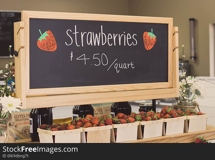 Strawberries for 4.50 Per Quartz Signage Above Bunch of Strawberries