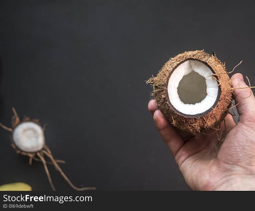 Person Holding Opened Coconut