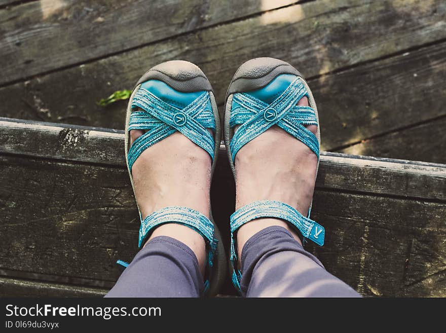 Person Wearing Pair of Blue Leather Sandals