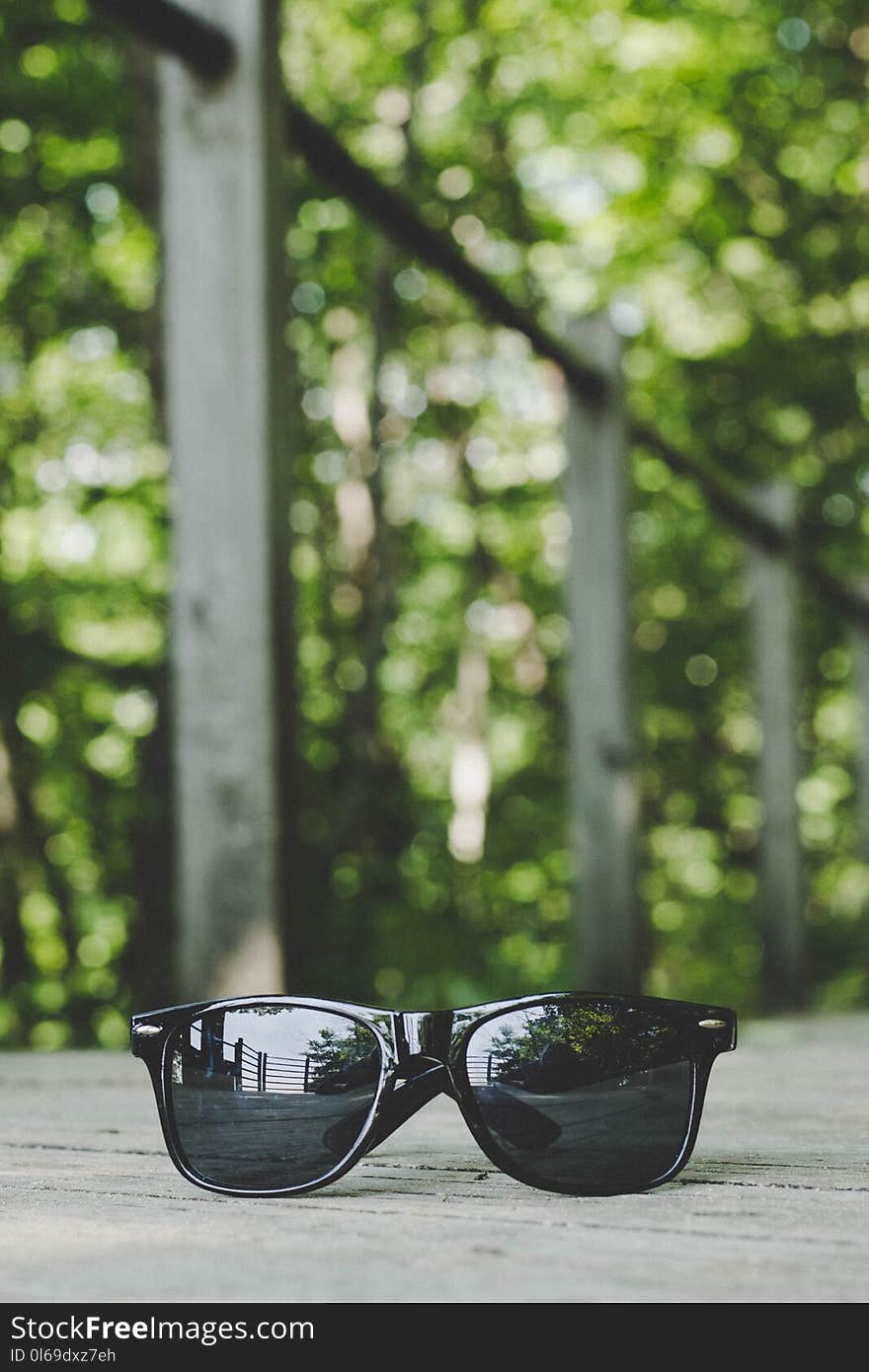 Selective Focus Photography of Black Framed Sunglasses